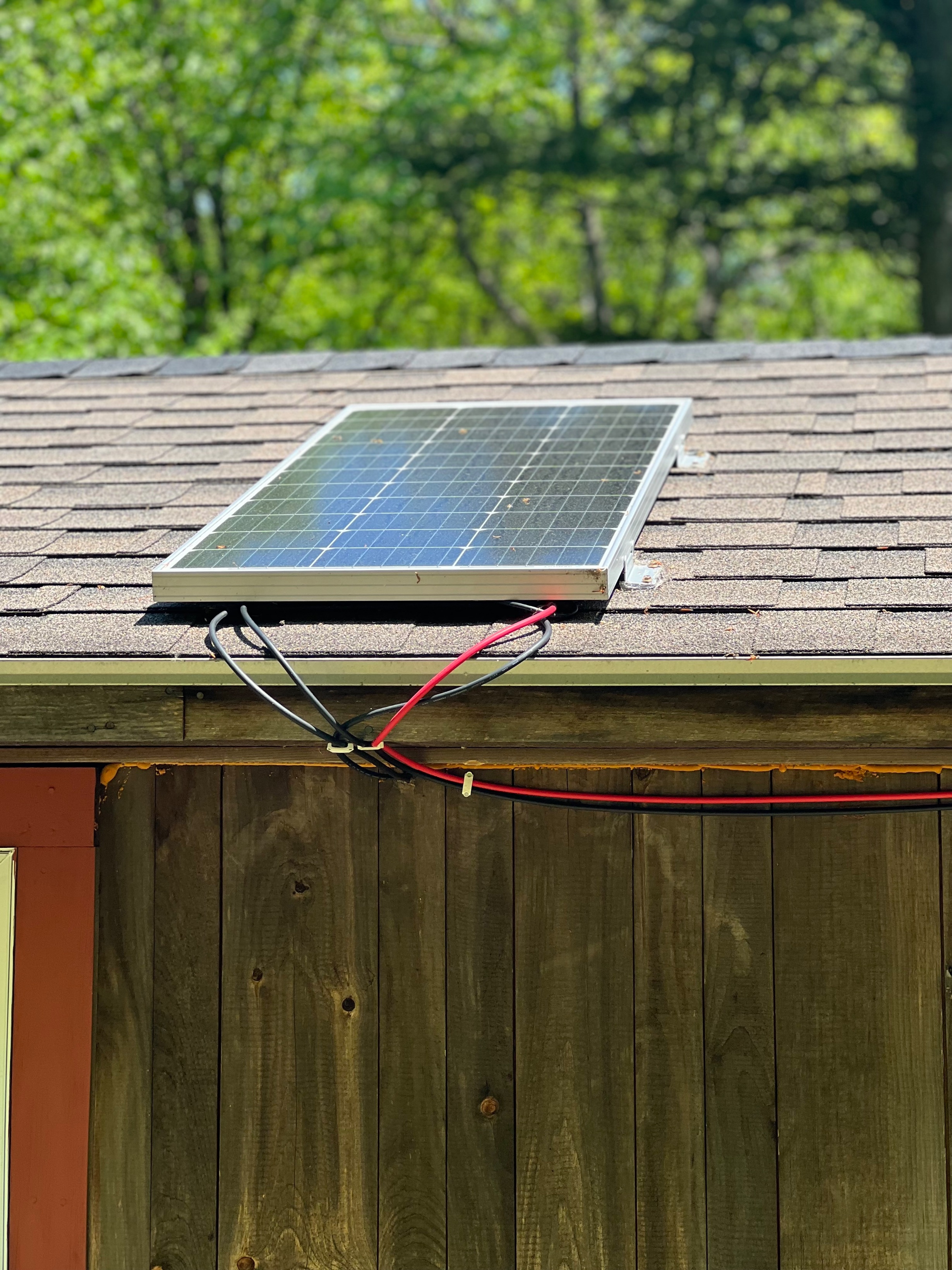 Solar panel on the camp roof, wired and working