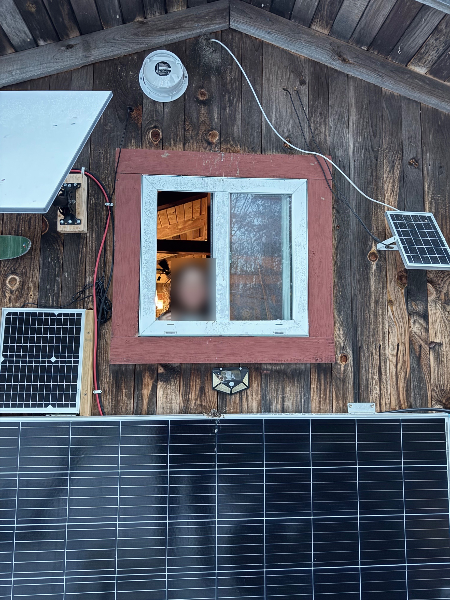 Starlink dish and panels on the camp wall - connected even off-grid